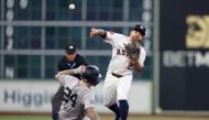 Jose Altuve #27 of the Houston Astros forces out Alex Verdugo #24 of the New York Yankees out at second and throws to first for a double play in the second inning on opening day at Minute Maid Park on March 28, 2024 in Houston, Texas. (Photo by Tim Warner / GETTY IMAGES NORTH AMERICA / Getty Images via AFP)
