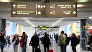 Passengers walk in the departure area of Sofia Airport after Bulgaria's official partial entry (air and sea) into the Europe's open-borders Schengen area on March 31, 2024. Photo by Nikolay DOYCHINOV / AFP. 
