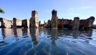 The picture taken on April 4, 2024, during a press preview, shows a new water feature which has been installed at Rome's Baths of Caracalla (Terme di Caracalla) which reflects the ancient Roman ruins like a mirror. Photo by Tiziana FABI / AFP