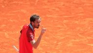 Russia's Daniil Medvedev reacts as he plays against Russia's Karen Khachanov during their Monte Carlo ATP Masters Series Tournament round of 16 tennis match on the Rainier III court at the Monte Carlo Country Club on April 11, 2024. (Photo by Valery HACHE / AFP)