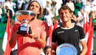 First placed Greece's Stefanos Tsitsipas (L) and second placed Norway's Casper Ruud celebrate with their trophies at the end of their Monte Carlo ATP Masters Series Tournament final tennis match on the Rainier III court at the Monte Carlo Country Club on April 14, 2024. (Photo by Valery HACHE / AFP)
