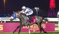 Soufiane Saadi steers Fayq Al Shahania to victory yesterday. RIGHT: The connections of Fayq Al Shahania celebrate after the Musheireb Cup win. PICS: Juhaim/QREC  