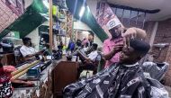 A Sudanese barber works inside a barbershop at the Al-Sufi neighborhood in downtown Cairo, Egypt, on April 16, 2024. (Xinhua/Ahmed Gomaa)
