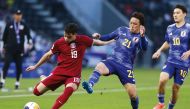 Qatar’s Ahmed Al Rawi in action against Japan’s A Ohata (centre) and Kein Sato yesterday. 
PIC: Rajan Vadakkemuriyil / The Peninsula 