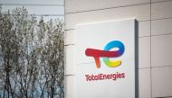 A photograph shows the logo of TotalEnergies at the Total Energies refinery site, in Gonfreville-l'Orcher, near Le Havre, northwestern France, on October 5, 2022. Photo by Lou BENOIST / AFP.