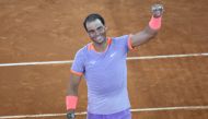 Spain's Rafael Nadal celebrates victory against Australia's Alex De Minaur at the end of the second round of the 2024 ATP Tour Madrid Open tournament tennis match at Caja Magica in Madrid on April 27, 2024. (Photo by Thomas COEX / AFP)
