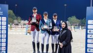 Cyrine Cherif (centre) Mohammed Khalifa Al Baker (left) and Faleh Suwead Al Ajami pose on the podium with CEO of Zabarjad Jewellery Enas Mohamed.  