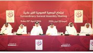 QSL President Jassim bin Rashid Al Buenain (third left) and CEO Hani Taleb Ballan (third right) during the Extraordinary General Assembly Meeting yesterday. QSL  