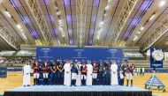 Qatar Equestrian Federation President Badr Mohammed Al Darwish, Director of Programs at the Social and Sports Activities Support Fund Ahmed Salem Al Ali and Director of the Commercial Department at Al Shaqab Ahmed Al Hammadi with the champion riders at the conclusion of the 14th and final round of the Longines Hathab Qatar Equestrian Tour season at Al Shaqab yesterday.