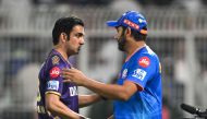 Mumbai Indians' Rohit Sharma (R) greets Kolkata Knight Riders' mentor Gautam Gambhir at the end of the Indian Premier League (IPL) Twenty20 cricket match between Kolkata Knight Riders and Mumbai Indians at the Eden Gardens in Kolkata on May 11, 2024. (Photo by DIBYANGSHU SARKAR / AFP)