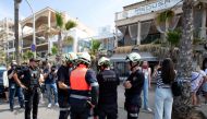 A Police officer investigates one day after a two-storey club-restaurant collapsed, killing four and injuring 16 people on Playa de Palma, south of the Spanish Mediterranean island's capital Palma de Mallorca, on May 24, 2024. Photo by Jaime REINA / AFP

