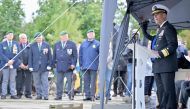 Rear Amiral Keith B. Davids gives a speech during the inauguration of a new monument dedicated to the NCDUs (Naval Combat Demolition Units) and Scouts and Raiders (Scouts et Commandos) on May 30, 2024 at Omaha Beach, Saint-Laurent-sur-Mer, northwestern France, as part of the commemoration of the 80th anniversary of D-Day. Photo by LOU BENOIST / AFP.
