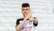 Rafa Mujica poses in Al Sadd jersey.