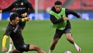 Dortmund's English midfielder #10 Jadon Sancho is tackled by Dortmund's German defender #15 Mats Hummels during a training session at Wembley stadium, in London, on May 31, 2024. (Photo by Glyn Kirk / AFP)