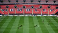 Groundstaff prepare the pitch ahead of the UEFA Champions League final football match between Borussia Dortmund and Real Madrid at Wembley stadium in London on June 1, 2024. (Photo by Paul Ellis / AFP)