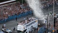 Real Madrid's players parade on their bus on Cibeles square to celebrate their 15th Champions League trophy, one day after beating Borussia Dortmund in London, in Madrid on June 2, 2024. (Photo by Pierre-Philippe Marcou / AFP)

