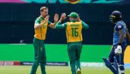 (L-R) South Africa's Anrich Nortje celebrates with South Africa's Keshav Maharaj (C) after Sri Lanka's Kamindu Mendis (R) is dismissed during the ICC men's Twenty20 World Cup 2024 group D cricket match between Sri Lanka and South Africa at Nassau County International Cricket Stadium in East Meadow, New York on June 3, 2024. (Photo by TIMOTHY A. CLARY / AFP)

