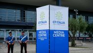 Police officers stand outside the G7 Italy 2024 media centre in Bari, Italy, on June 11, 2024. (Photo by Piero Cruciatti / AFP)


