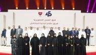 QOC Secretary General Jassim bin Rashid Al Buenain and other QOC officials pose for a group photo during the ceremony.