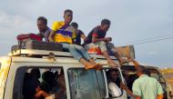 Peolpe displaced from Sudan's Jazira state arrive in packed vehicles to the entrance of the eastern city of Gedaref on June 10, 2024, amid the ongoing conflict between the Sudanese army and the paramilitary Rapid Support Forces (RSF). Photo by AFP.