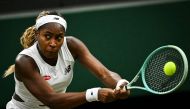 US player Coco Gauff returns the ball to Britain's Sonay Kartal during their women's singles tennis match on the fifth day of the 2024 Wimbledon Championships at The All England Lawn Tennis and Croquet Club in Wimbledon, southwest London, on July 5, 2024. (Photo by Ben Stansall / AFP)