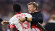 Alphonso Davies of Canada celebrates with Jesse Marsch, Head Coach of Canada after the CONMEBOL Copa America 2024 quarter-final match on July 05, 2024. Ron Jenkins/Getty Images/AFP 