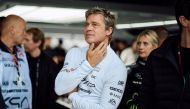 Hollywood actor Brad Pitt, acting in an upcoming Formula One-based movie, follows the second practice session at the Silverstone motor racing circuit on July 5, 2024. (Photo by Benjamin Cremel / AFP)