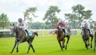 Maxime Guyon guides Intisar De Monlau towards the finish line.