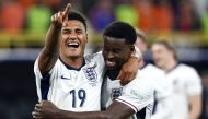 England's forward #19 Ollie Watkins (L) and England's defender #06 Marc Guehi celebrate after winning the UEFA Euro 2024 semi-final football match on July 10, 2024. (Photo by Kenzo Tribouillard / AFP)