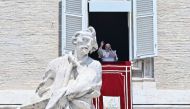 Pope Francis delivers his blessing during the Angelus prayer from the window of the Apostolic Palace overlooking St. Peter's Square, during the Angelus prayer at the Vatican on July 21, 2024. (Photo by Filippo MONTEFORTE / AFP)
