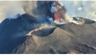 (Files) A picture shows the eruption of the Mount Etna volcano on July 4, 2024 in Sicily. (Photo by Giuseppe Distefano / various sources / AFP)

 