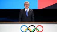 International Olympic Committee (IOC) President Thomas Bach stands during the Olympic anthems during the 142nd session of the IOC in Paris on August 10, 2024, during the Paris 2024 Olympic Games. (Photo by Fabrice COFFRINI / AFP)
