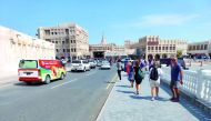 A file photo of tourists walking towards the markets at Souq Waqif.