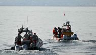 Divers of the Vigili del Fuoco, the Italian Corps. of Firefighters leave Porticello harbor near Palermo, to resume research for a last missing person on August 23, 2024, four days after the British-flagged luxury yacht Bayesian sank. (Photo by Alberto PIZZOLI / AFP)
