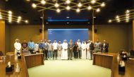 Officials from QC, Young Entrepreneurs Club and Qatar Post along other attendees during the workshop.
