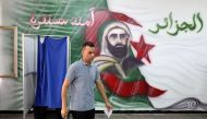 An Algerian man votes at a polling station during the presidential election, in Algiers on September 7, 2024. Photo by AFP.