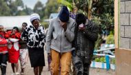 Family members react after visiting the burned dorm room at the Nyeri county's Hillside Endarasha Academy in Nyeri county on September 6, 2024 after a fire broke out killing 17 children. Photo by SIMON MAINA / AFP.