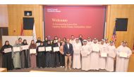 Participants in the WCM-Q Healing Hands essay contest with members of the faculty and staff.