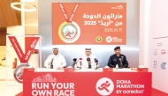 Doha Marathon by Ooredoo Vice Chairman Sabah Rabiah Al Kuwari, Qatar Athletics Federation President Mohammed Essa Al Fadala and Ministry of Interior Representative Major Fahad Bouhendi Al Harami during the press conference.   