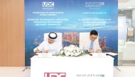UDC President, CEO, and Member of the Board, Ibrahim Jassim Al Othman, and the President of QSTP, Dr. Jack Lau during the agreement signing.