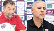 Kuwait coach Juan Antonio Pizzi (left) and Palestine coach Makram Daboub