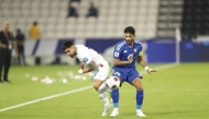 Action during the match between Palestine and Kuwait at the Jassim Bin Hamad Stadium yesterday. Pic: AMR DIAB / THE PENINSULA