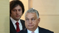 Georgian Prime Minister Irakli Kobakhidze and visiting Hungarian Prime Minister Viktor Orban arrive for a joint briefing at the state chancellery in Tbilisi on October 29, 2024. (Photo by Vano SHLAMOV / AFP)
