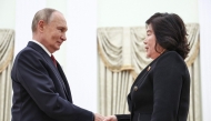 In this pool photograph distributed by Russian state agency Sputnik, Russia's President Vladimir Putin (L) greets North Korea's Foreign Minister Choe Son Hui (R) prior to their talks in Moscow on November 4, 2024. (Photo by Mikhail TERESHCHENKO / POOL / AFP)
