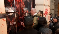 A group of protesters tries to enter the city hall during a protest in Novi Sad on November 5, 2024, after a train station roof collapsed last week killing 14 people. (Photo by Nenad MIHAJLOVIC / AFP)
