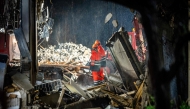 Emergency services search for victims a day after a fire and an explosion that partially collapsed a residential building in The Hague on December 8, 2024. (Photo by Josh Walet / ANP / AFP)
