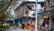 Rescuers work on the site where an explosion and fire destroyed an apartment block, killing at least six people, on the Tarwekamp in The Hague on December 9, 2024. (Photo by Josh Walet / ANP / AFP) / Netherlands OUT
