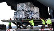 French military unload medical and emergency equipment from the A440M military aircraft, aboard of which rescue teams were transported in an emergency response, bringing aid to the small French Indian Ocean territory of Mayotte, almost cut off from the world after the passage of cyclone Chido, at the French Air Force Base 181 Saint-Denis-La Reunion 