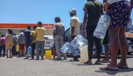 Motorists join long queues at a gas station in Maputo on December 27, 2024. (Photo by Amilton Neves / AFP)
