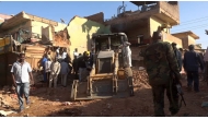 This photo taken on Feb. 1, 2025 shows workers using a loader to remove debris of a building damaged during an attack at Sabreen Market in Karari locality of Omdurman, north of the Sudanese capital Khartoum. (Khartoum State Press Office/Handout via Xinhua)
